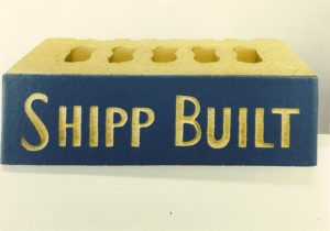 Shipp name stamped on a building brick